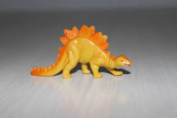 Toy dinosaur on white background