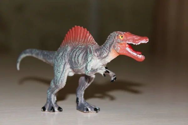 Spinosaurus toy dinosaur on background