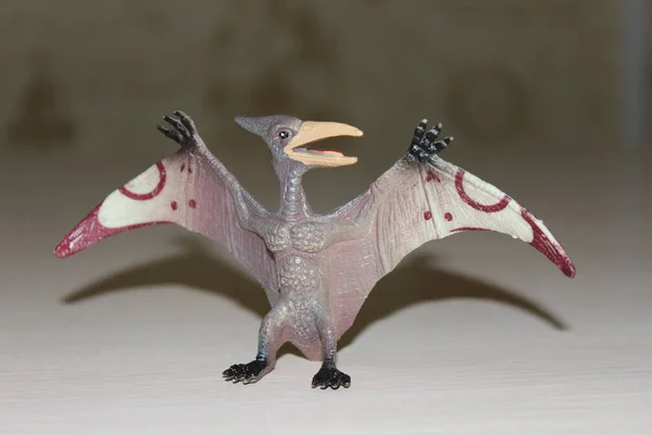 Pterodactyl toy dinosaur on background