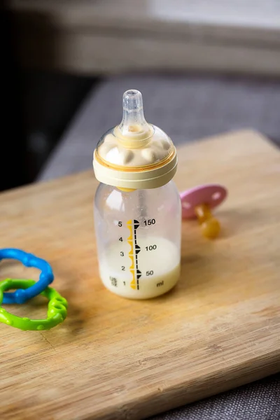 Portrait Baby Bottle Bit Milk Still Standing Wooden Plank Glass — Foto de Stock