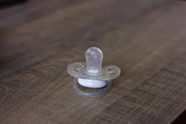 Portrait Pacifier Lying Wooden Table Indoor Living Room Soother White — Fotografia de Stock