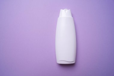 shampoo or hair conditioner bottle on blue background