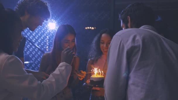 Friends celebrating with cake and sparklers in party — 비디오