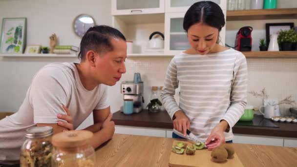 Young Married Couple Cooking Together Kitchen Home Young Woman Feeding — Vídeos de Stock