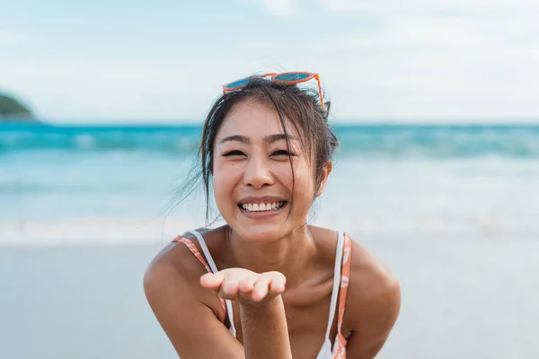 Smiling Beautiful Asian Woman Blowing Kiss Bikini Beach Sea Background — Stockfoto