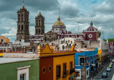 Puebla, Mexico - August 28, 2021 - aerial view of colonial houses in the historic center of Puebla with Puebla Cathedral from the rooftop of Museo Amparo clipart