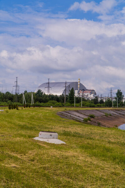 Pripyat, Ukraine - June 10, 2021 - vertical view of Reactor 4 of the Chernobyl power plant with the new safe confinement
