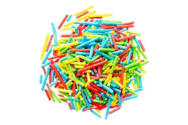 Rainbow sprinkle for confectionery, top view. Colorful confetti on a white background, top view. Confectionery multi-colored sprinkles for decoration. Pile of confectionery sprinkles, top view. — Stock Photo, Image