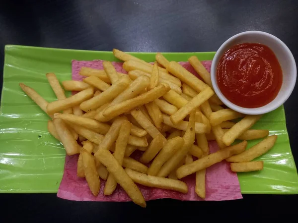 French Fries Tomato Sauce Green Melamine Plate Top View — Zdjęcie stockowe