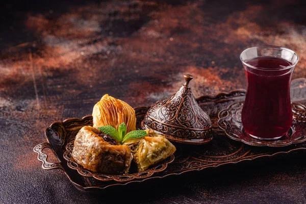 Traditional turkish, arabic sweets baklava with Turkish tea.