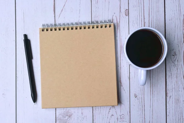 Top View Notepad Pen Cup Coffee Wooden Desk Workspace Concept — Fotografia de Stock