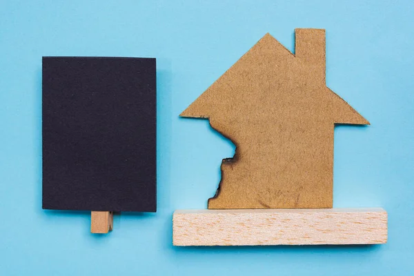 Burned Paper House Model Black Notepad Blue Background Home Insurance — Stock Photo, Image