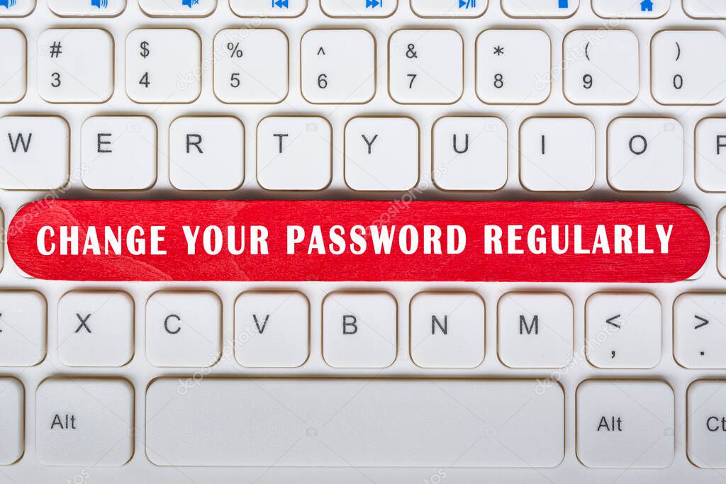 Change your password regularly text on wooden stick placed on laptop or notebook. Password security concept.