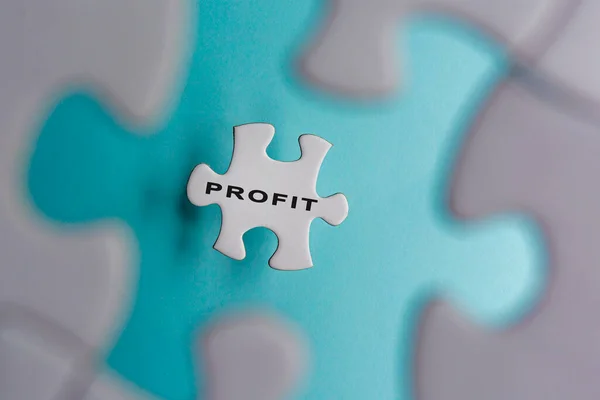 Profit Word Puzzle Pieces Isolated Blue Background Business Finance Concept — Φωτογραφία Αρχείου