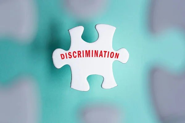 Discrimination Word Puzzle Pieces Isolated Blurred Green Background — Φωτογραφία Αρχείου