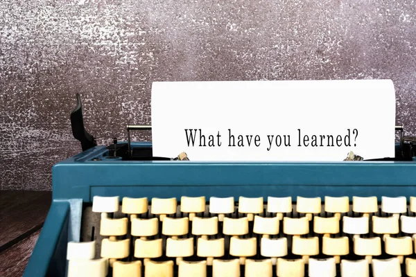 What have you learned words typed on an old typewriter. New year resolution concept.