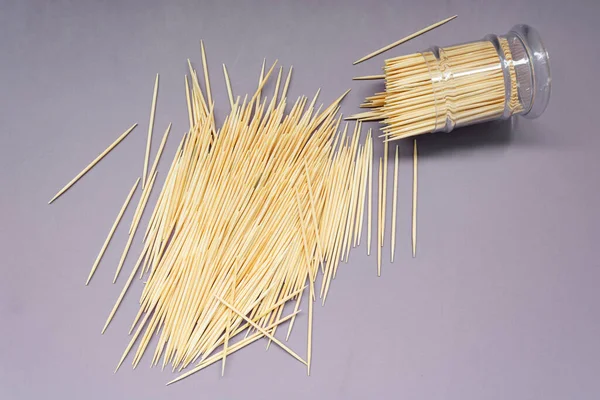 Pile Wooden Toothpicks Toothpick Box Plastic Cover Purple Background Copy — 图库照片