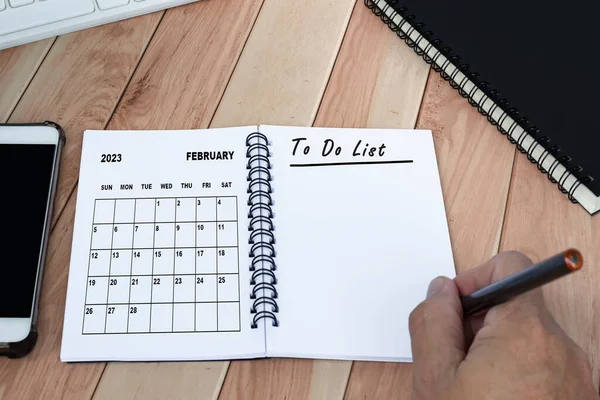 Businessman Hands Pen Writing List Bebruary 2023 Calendar Notebook Copy — стоковое фото