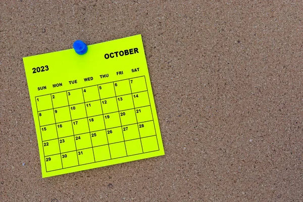October 2023 Yellow Sticky Note Calendar Pin Cork Bulletin Billboard — стоковое фото