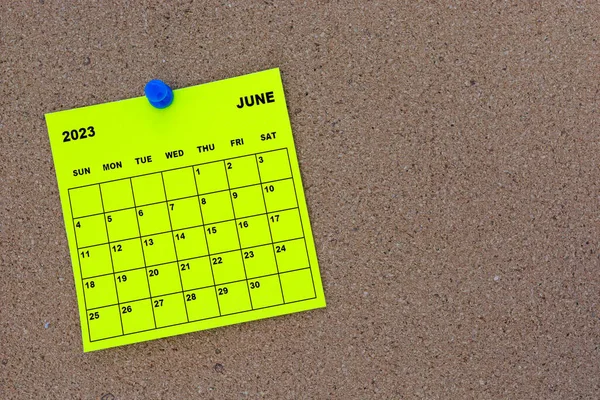 June 2023 Yellow Sticky Note Calendar Pin Cork Bulletin Billboard — стоковое фото