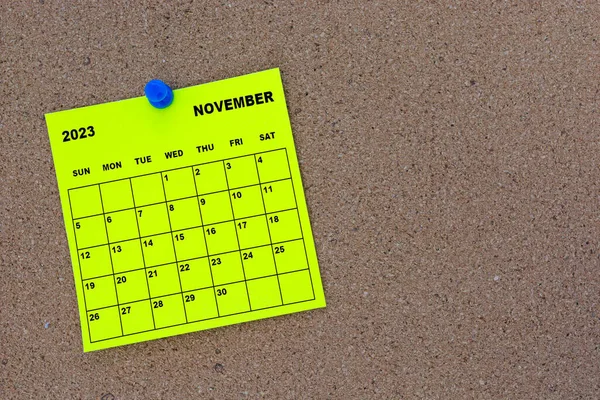 November 2023 Yellow Sticky Note Calendar Pin Cork Bulletin Billboard — стоковое фото