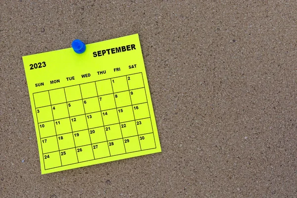 September 2023 Yellow Sticky Note Calendar Pin Cork Bulletin Billboard — стоковое фото