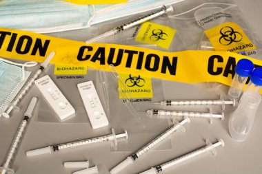 Lab card kit tested POSITIVE for viral novel coronavirus virus with blurred bacground of test kit for disease COVID-19