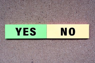 Yes No words on note with wooden background. Approved and Declined concept.