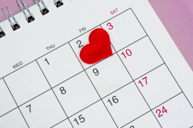 Red heart shape on the date of the 2nd day in the calendar. Important calendar date to remember.