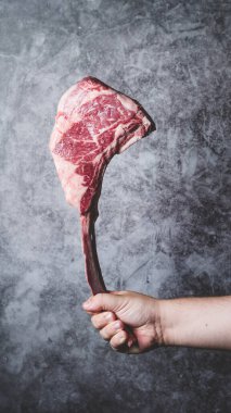 Tomahawk axe shaped piece of meat