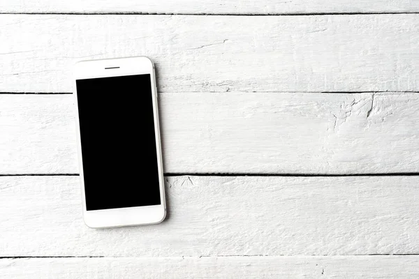 Beyaz Ahşap Masadaki Boş Ekranlı Cep Telefonu Görüntüsü Stok Resim