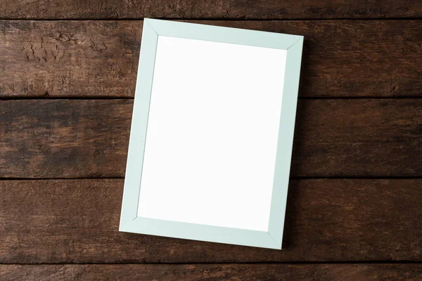 Ahşap arkaplanda boş resim çerçevesi