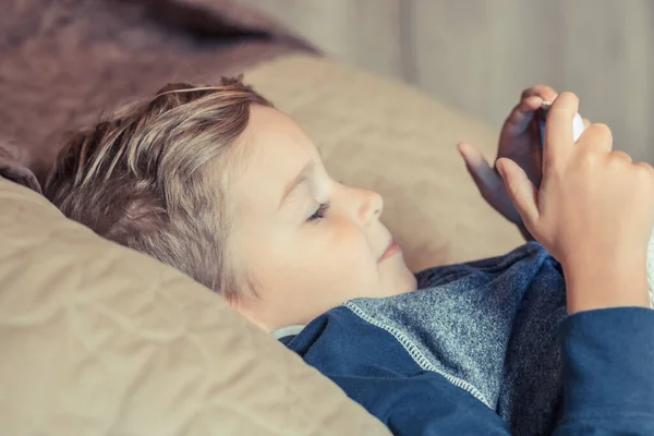 Little Boy Watching Cartoons Internet While Relaxing Bed Night — Stock fotografie