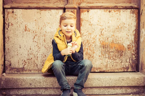 Cute Kid Sitting Steps While Relaxing Outdoors — Stock fotografie