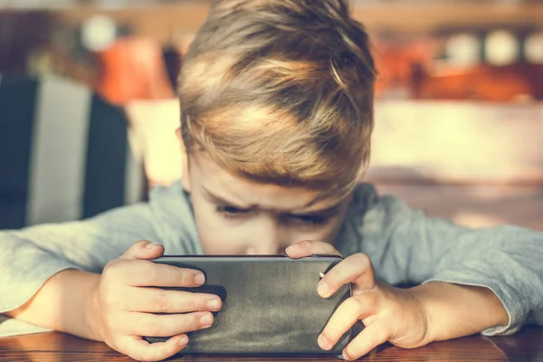 Little Boy Using Mobile Phone Watching Something Internet — Foto de Stock
