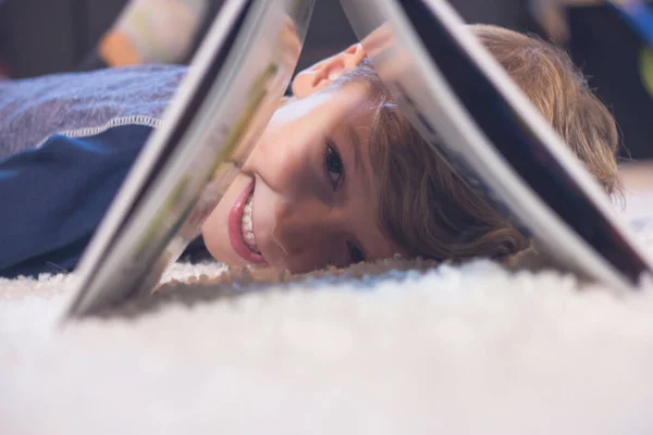 Happy Kid Peeking Book Having Fun Carpet — Stock fotografie