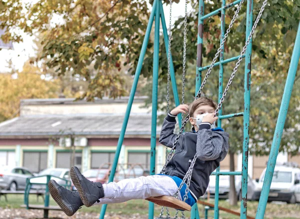 Little Boy Wearing Face Mask While Swinging Park — ストック写真