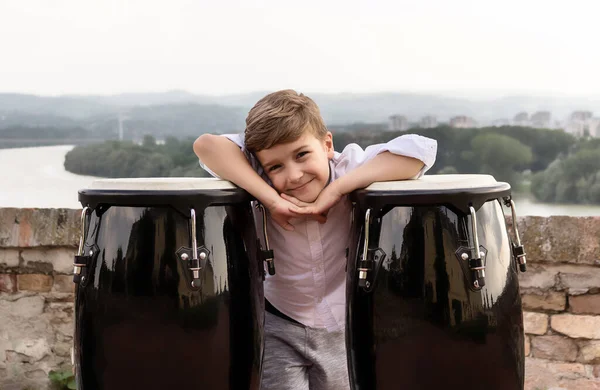 Happy Boy Leaning Bongos Looking Camera — Zdjęcie stockowe