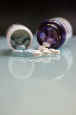 Prescription medicines and vitamins. Pill bottles with painkillers. 