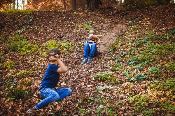 Two Boys Throwing Autumn Leaves Each Other While Playing Park — Stok fotoğraf