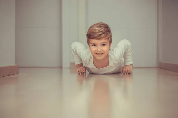 Playful Kid Having Fun While Crawling Parquet Floor Home — Φωτογραφία Αρχείου