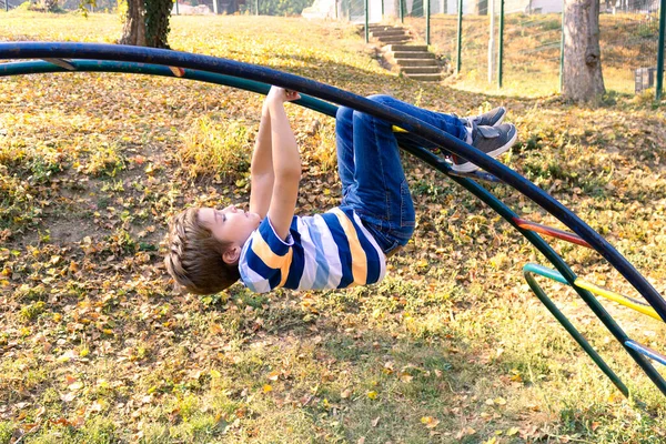 Playful Little Boy Having Fun While Hanging Monkey Bars Playground — Stock Photo, Image