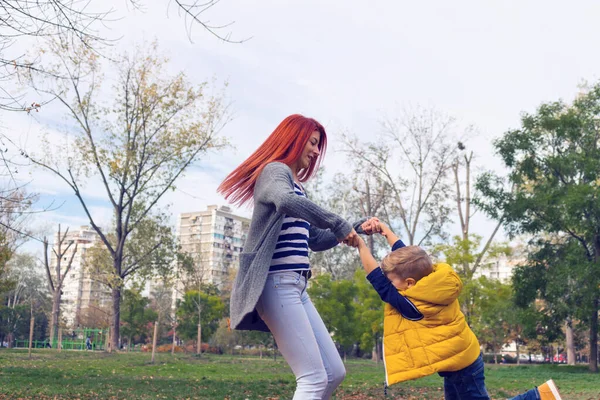 Carefree Mother Holding Hands Her Son Turning Park — Stock Photo, Image
