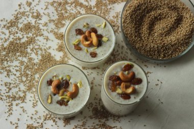Kodo millet pudding. Rich creamy sweet dessert garnished with ghee roasted raisins and nuts. An indian pudding made with roasted kodo millet and milk. Sweetened with sugar and Flavoured with cardamon