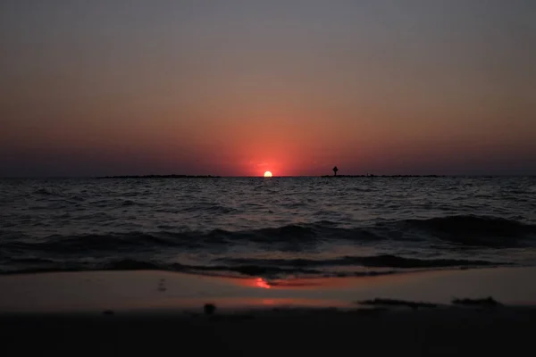 This is the sunset at Cypremort Point State Park Beach near the Gulf Coast of Louisiana on the Vermilion Bay.