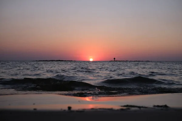 This is the sunset at Cypremort Point State Park Beach near the Gulf Coast of Louisiana on the Vermilion Bay.
