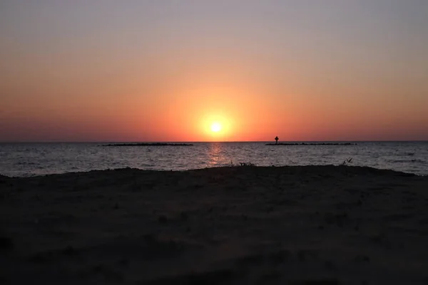 This is the sunset at Cypremort Point State Park Beach near the Gulf Coast of Louisiana on the Vermilion Bay.