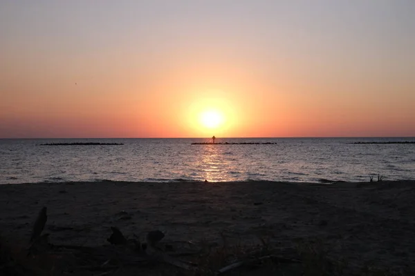 This is the sunset at Cypremort Point State Park Beach near the Gulf Coast of Louisiana on the Vermilion Bay.