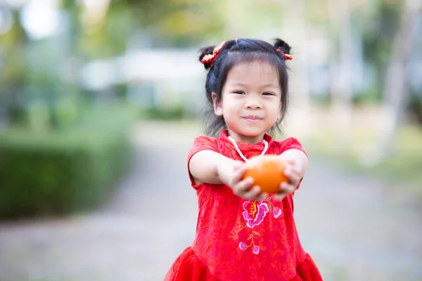 Year Old Child Girl Handing Orange Her Front Fruit Symbolizes — ストック写真