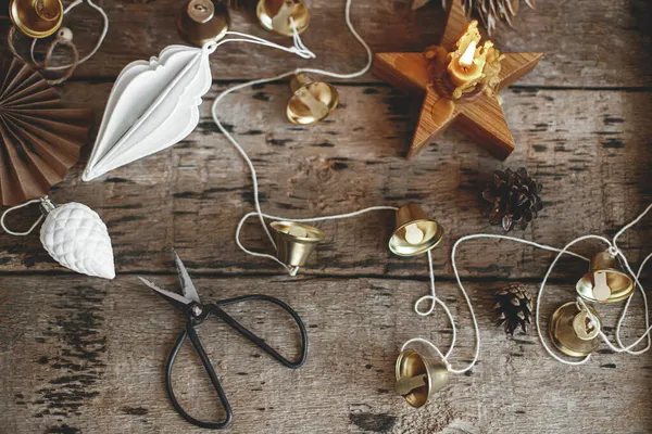 Stylish Christmas Bells Paper Angel Stars Ornaments Candle Thread Scissors — Stock Photo, Image
